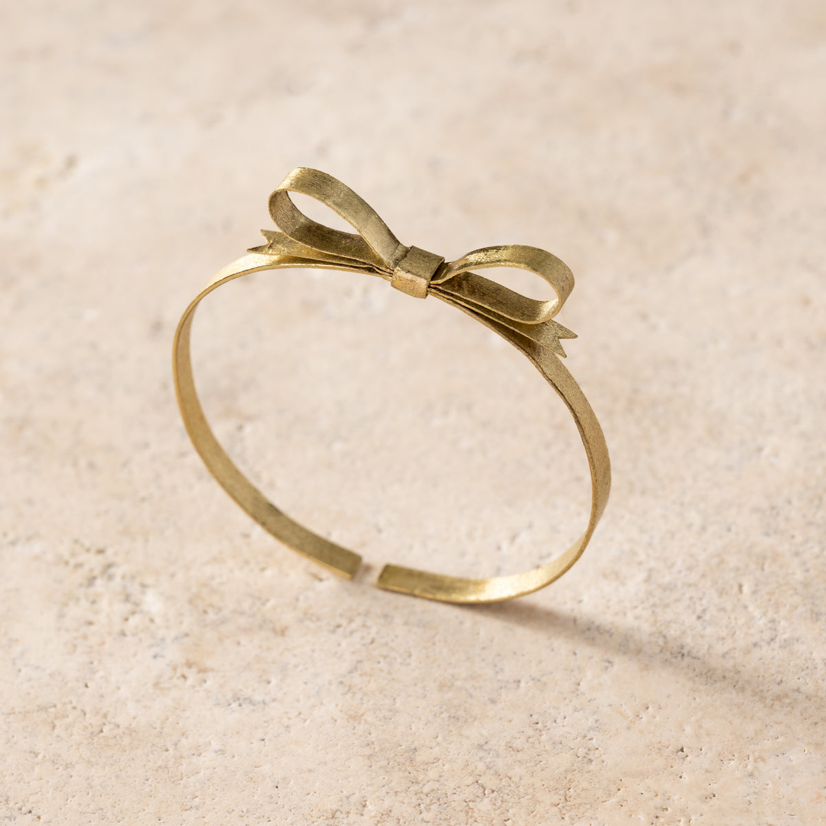Dorada Bronze Bow Bracelet - Ten Thousand Villages