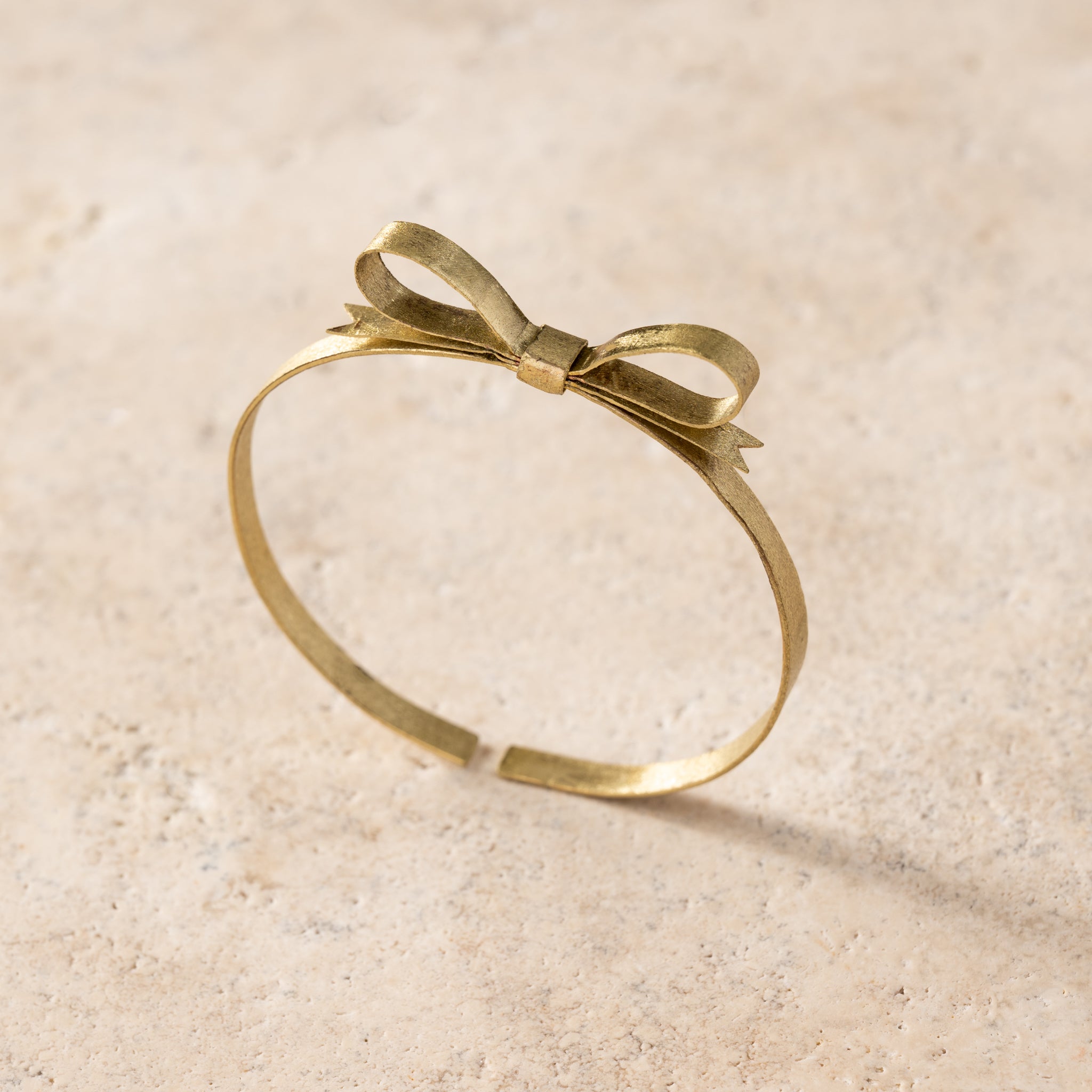 Dorada Bronze Bow Bracelet - Ten Thousand Villages